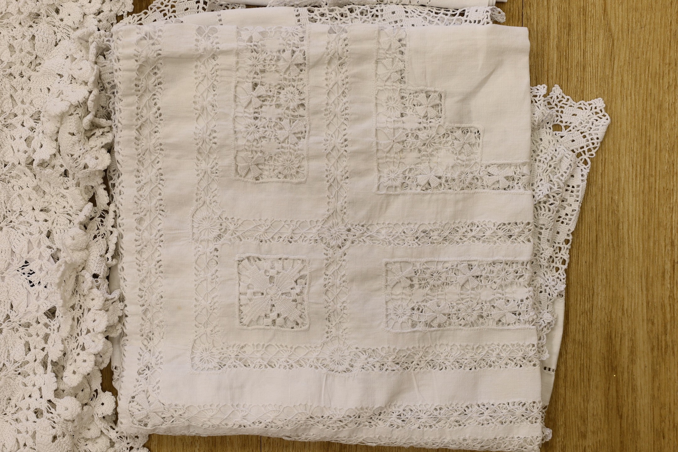 A group of lace table cloths